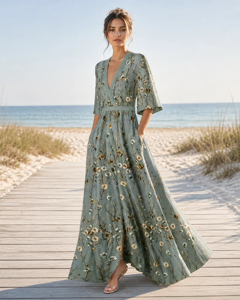 Fiorella sage green floral maxi dress on a summer boardwalk
