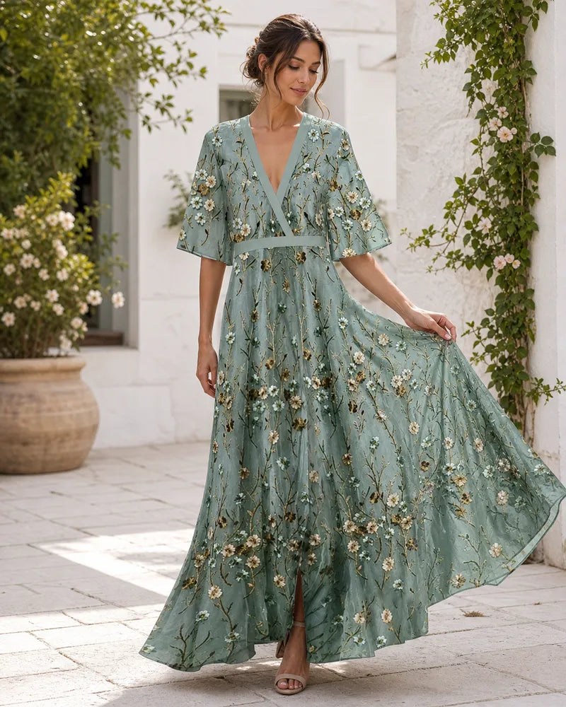 Fiorella floral maxi dress in motion in a summer courtyard