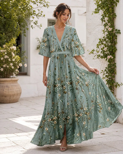 Fiorella floral maxi dress in motion in a summer courtyard