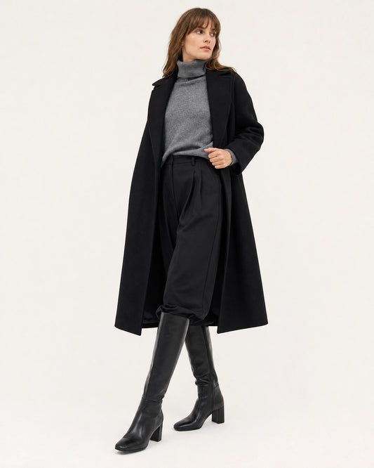 Women's black knee-high boots with a broad block heel, hero view.