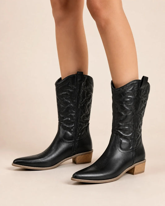Women's Evelyn black retro western cowboy boots, worn hero view.
