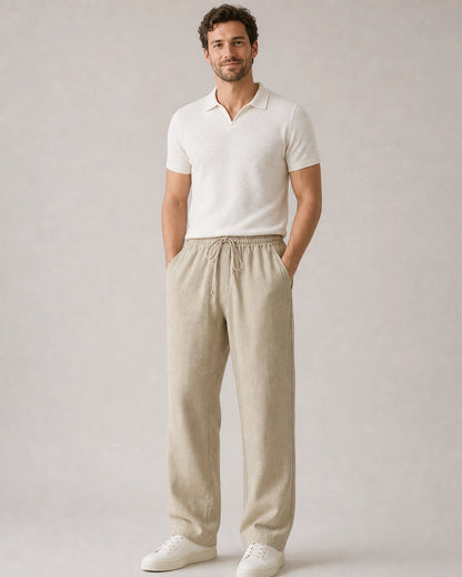 Man wearing beige linen wide-leg pants in a complete summer look.