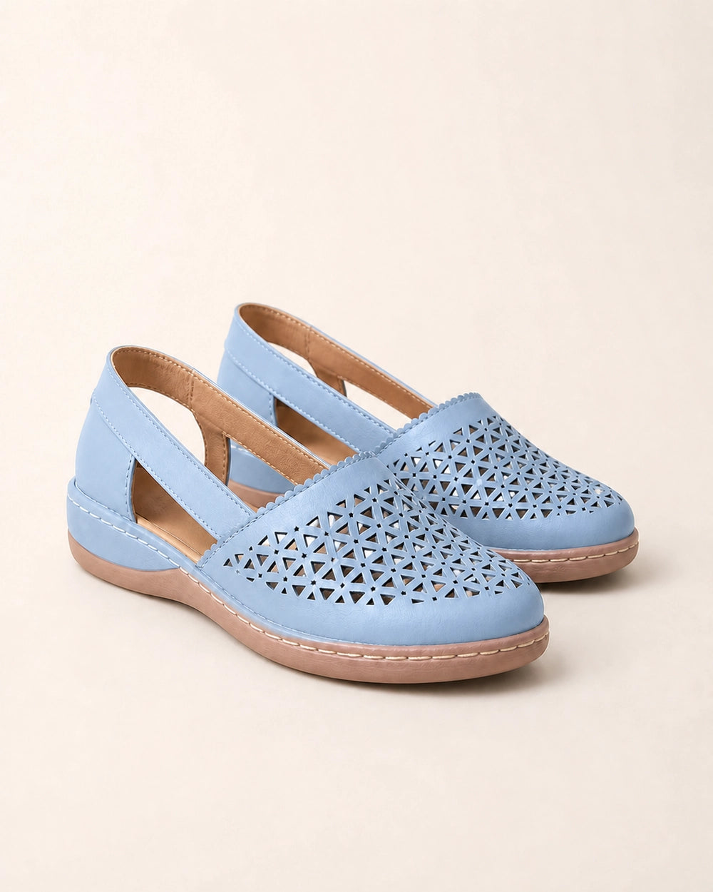 Pair of blue perforated slingback shoes.