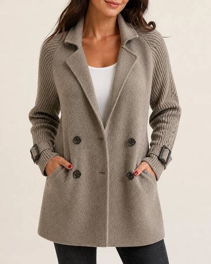 Taupe mid-length coat with knit sleeves worn, product hero.