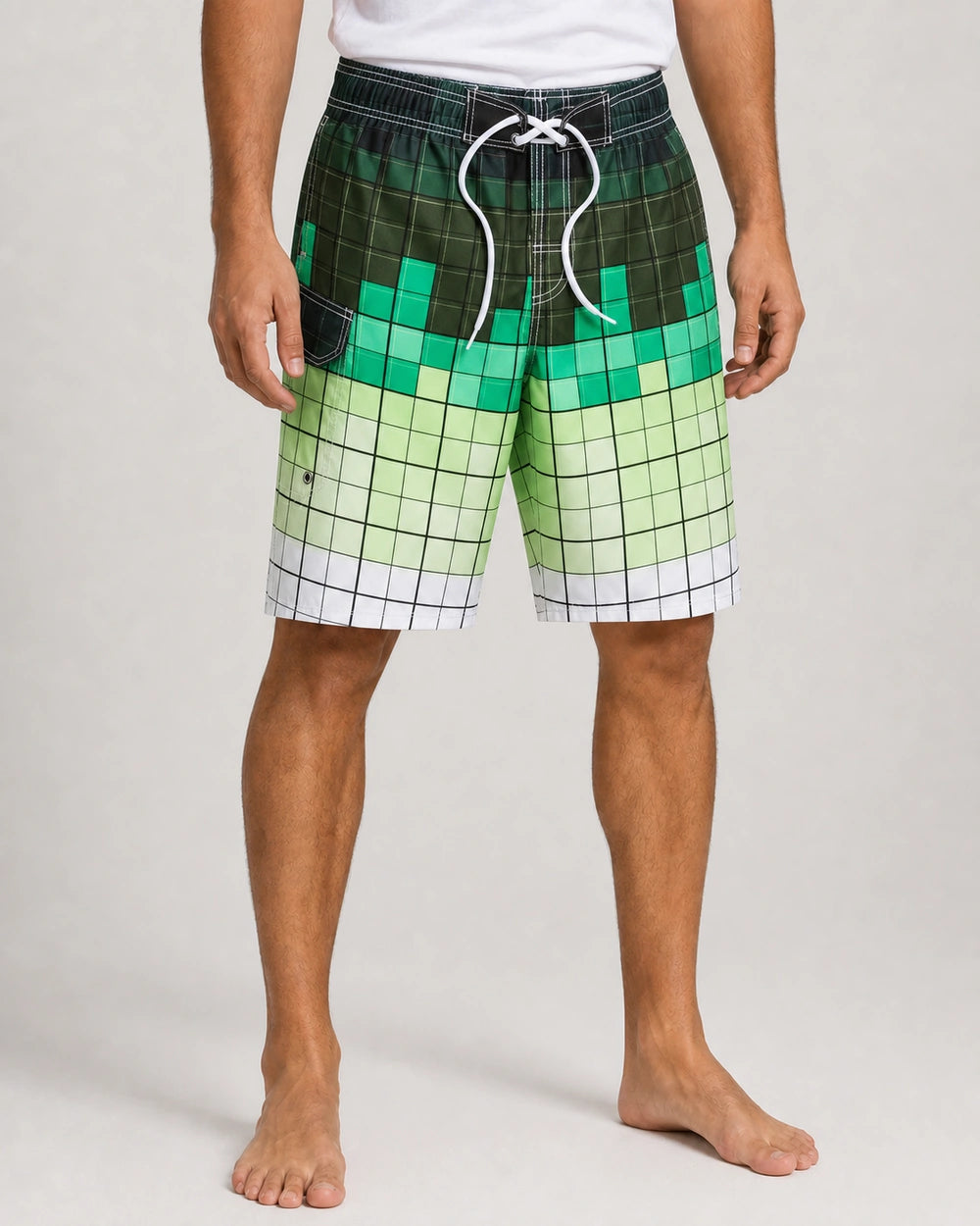 Green gradient plaid knee-length swim shorts, front view.