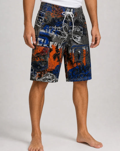 Dark blue and orange graphic knee-length swim shorts, front view.