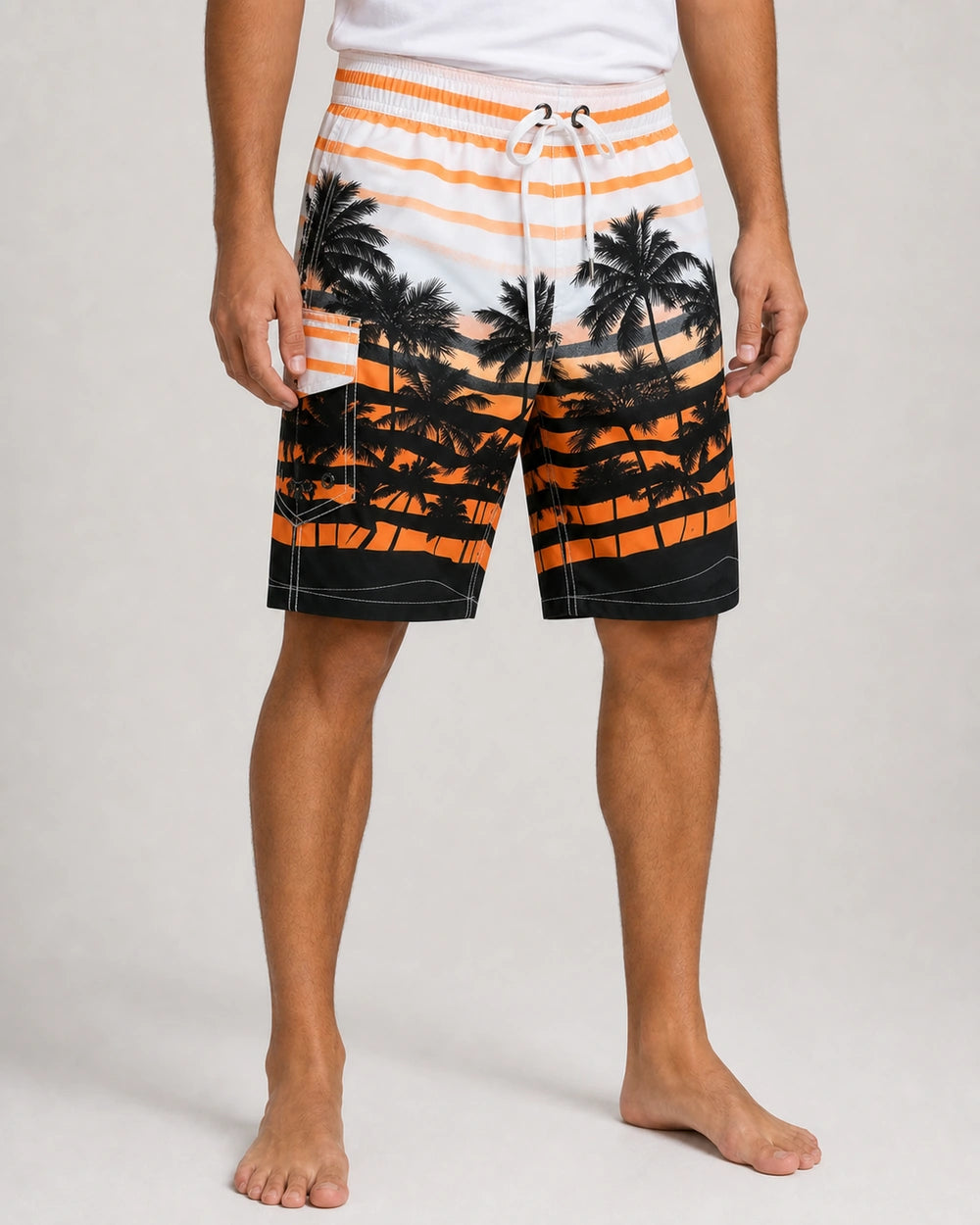 Orange and black palm-print knee-length swim shorts, front view.
