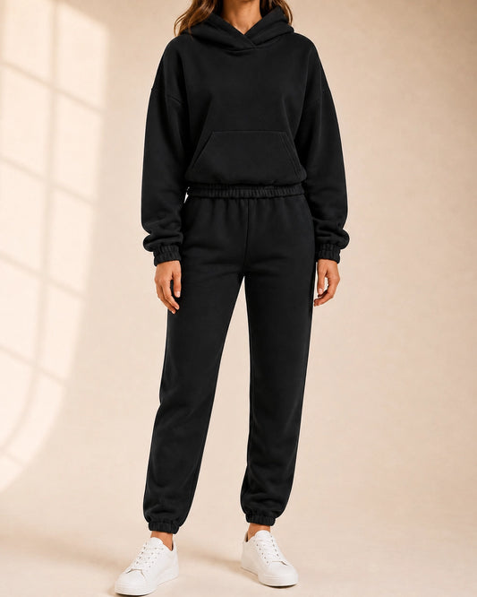 Women's black hooded two-piece jogger set, front view.